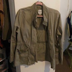 lightly worn green army jacket